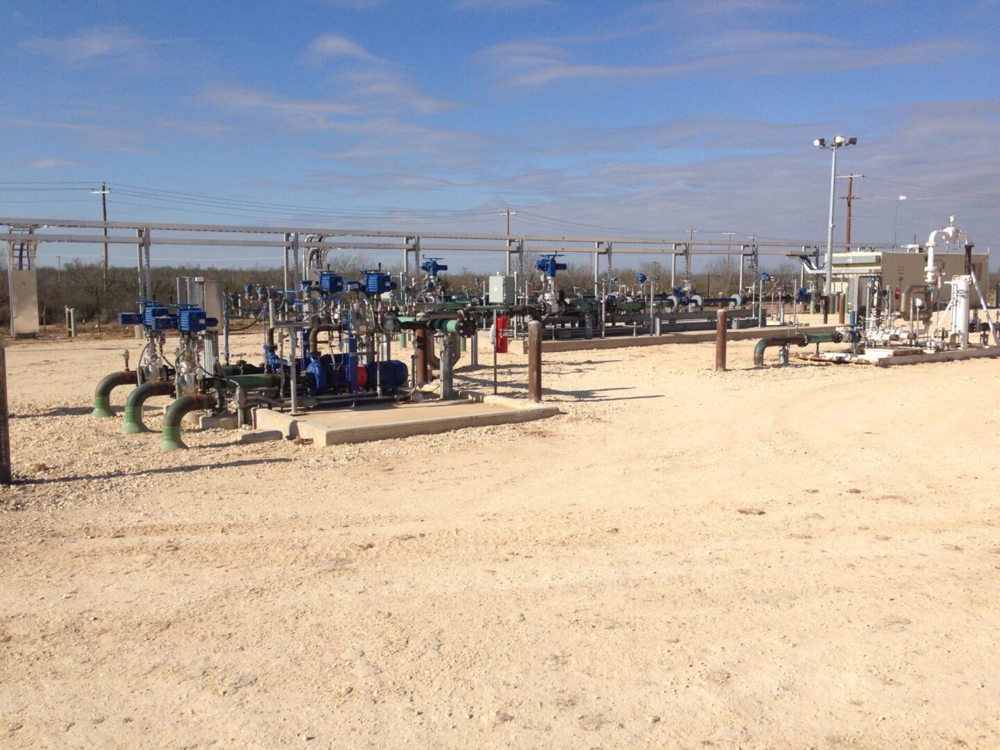 A field with many pipes and valves on it